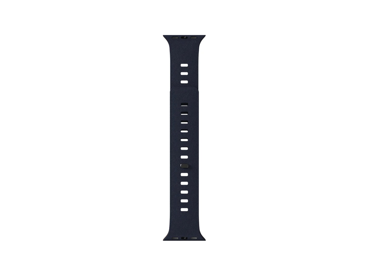 Navy blue silicone Apple Watch strap shown flat with multiple adjustment holes and an integrated magnetic pin closure