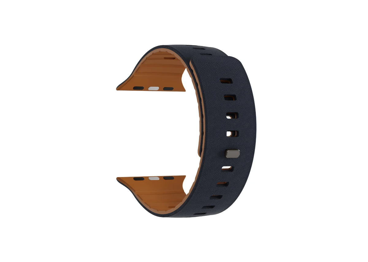 Navy blue and brown magnetic Apple Watch strap displayed without a watch, showing the textured outer surface, brown silicone interior and adjustment holes