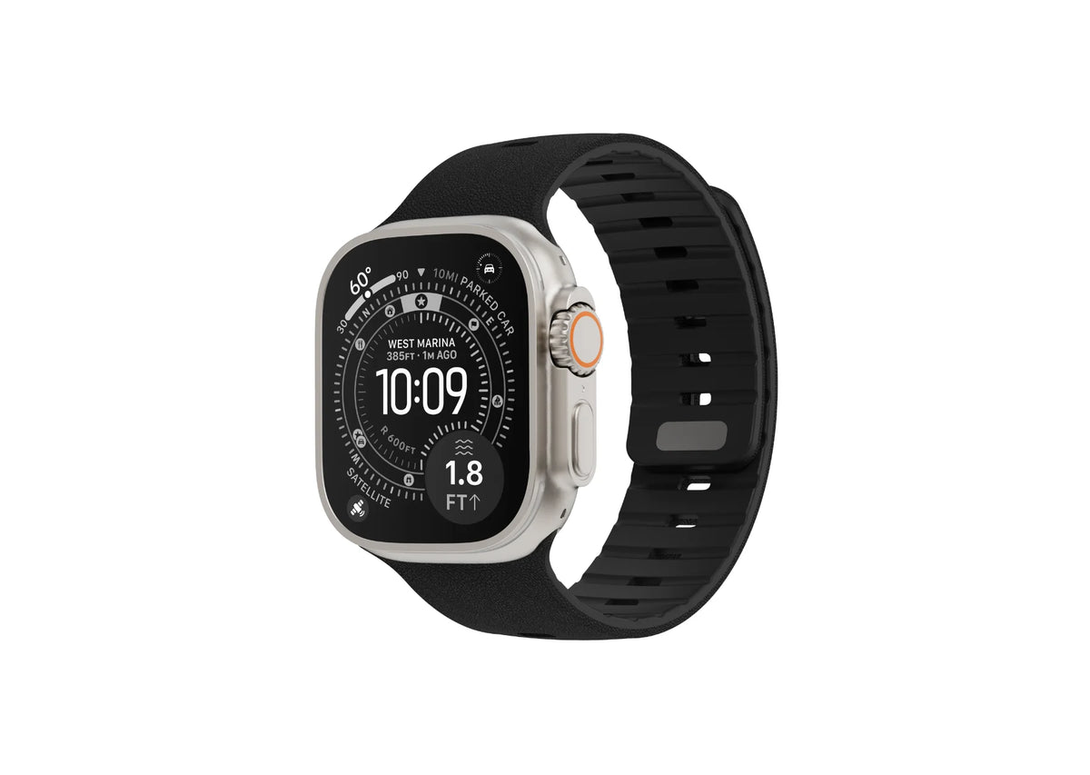 Black Apple Watch strap fitted on Apple Watch Ultra, showing the textured silicone finish and magnetic closure